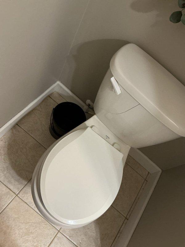 Responded to emergency service call regarding cracked toilet tank with active water leak. Removed damaged standard toilet and replaced with new ADA-compliant model. Installed new shut-off valves and addressed corroded floor flange during installation.