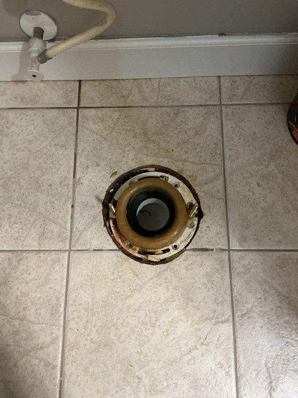 Responded to emergency service call regarding cracked toilet tank with active water leak. Removed damaged standard toilet and replaced with new ADA-compliant model. Installed new shut-off valves and addressed corroded floor flange during installation.
