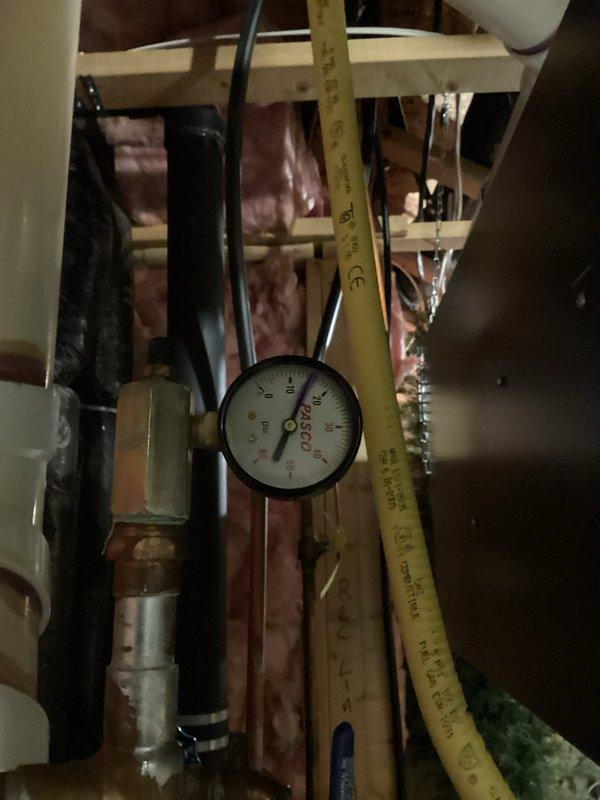Diagnosed low water pressure issue in infloor heating boiler system. Increased pressure to 15psi, purged air from loops and pump, and verified pump operation. Set water temperature to 135°F and cycled system to confirm restoration of normal operation for the infloor heating.