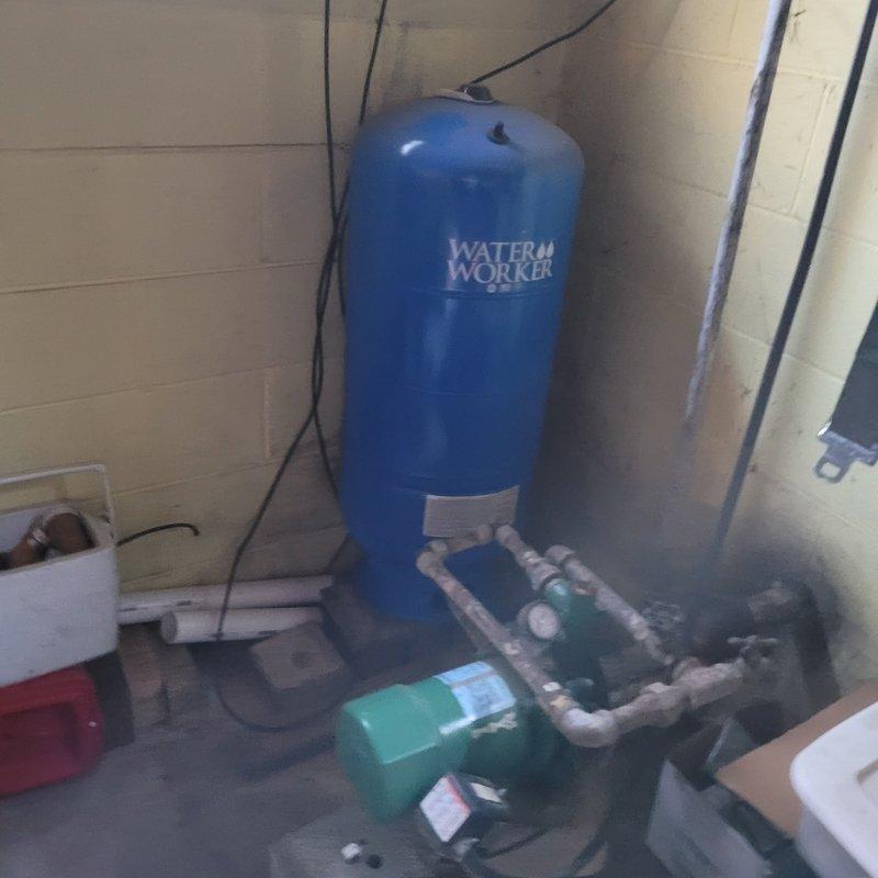 Replaced damaged hose bib with new code-compliant unit due to freeze break damage on backside. Addressed pressure tank issues by installing WX203 Wall Troll pressure tank and replacing associated piping after diagnosing air leak causing pressure retention problems. Additionally installed new icemaker water supply line that was previously non-existent.