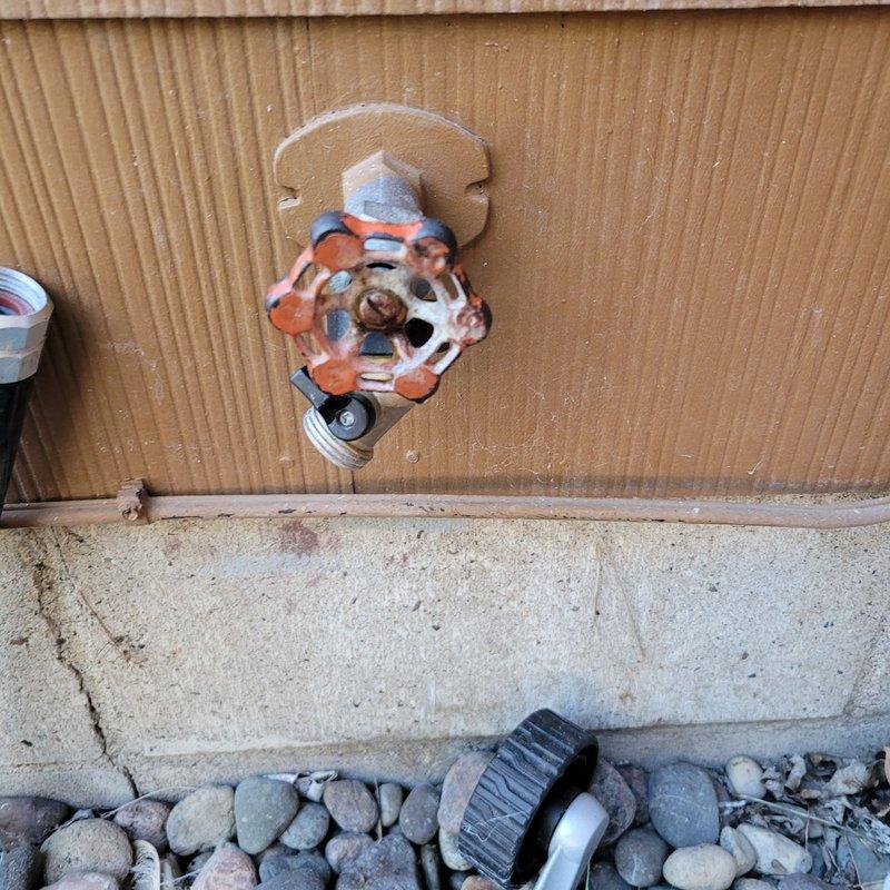 Replaced damaged hose bib with new code-compliant unit due to freeze break damage on backside. Addressed pressure tank issues by installing WX203 Wall Troll pressure tank and replacing associated piping after diagnosing air leak causing pressure retention problems. Additionally installed new icemaker water supply line that was previously non-existent.