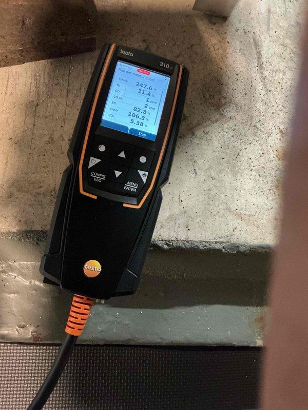 Performed annual tune-up on 8-year-old Slant Fin boiler. System inspection showed properly functioning pump, good system pressure, decent heat exchanger condition, and sound gas valve, backflow preventer, pressure relief valve, and piping with no leaks. Combustion analysis detected carbon monoxide leakage (up to 5ppm) from the lower right heat exchanger seal, with oxygen displacement by exhaust on the left side. Advised customer about Slant Fin's known seal deficiencies and recommended installation of low-level CO detectors to monitor the situation.