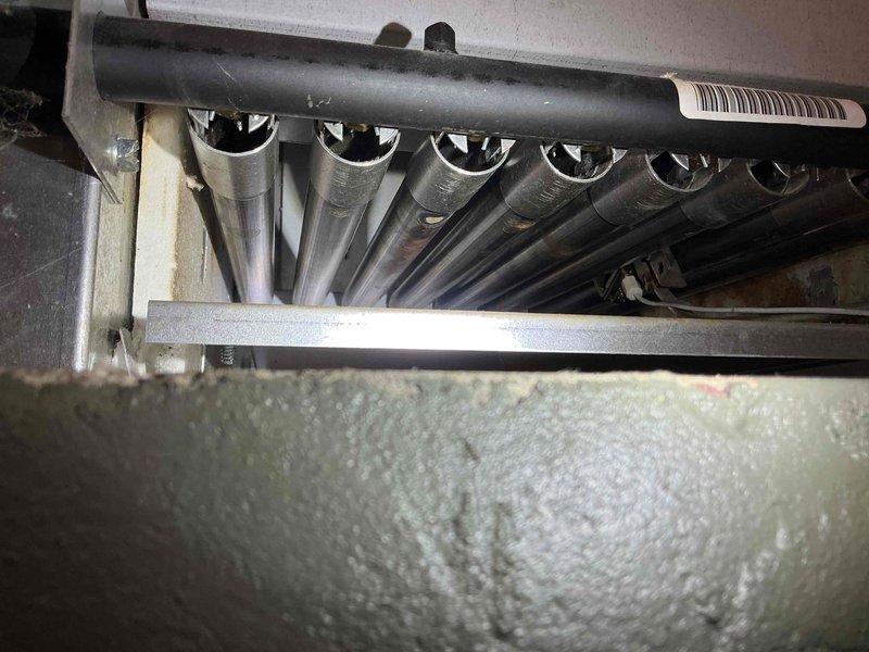 Performed annual tune-up on 8-year-old Slant Fin boiler. System inspection showed properly functioning pump, good system pressure, decent heat exchanger condition, and sound gas valve, backflow preventer, pressure relief valve, and piping with no leaks. Combustion analysis detected carbon monoxide leakage (up to 5ppm) from the lower right heat exchanger seal, with oxygen displacement by exhaust on the left side. Advised customer about Slant Fin's known seal deficiencies and recommended installation of low-level CO detectors to monitor the situation.