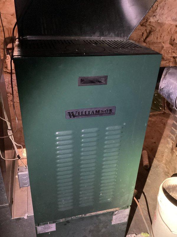 Performed maintenance tune-up on Williamson oil furnace. Removed bat from burner tube, replaced oil nozzle, tank filter, and air filter. Adjusted air mixture which was set too high causing lean burning. Noted minor bearing noise in Beckett burner motor which will need replacement - estimate provided to customer. Unit now operating properly.