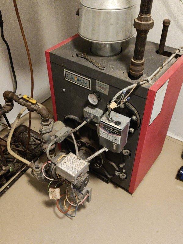 Performed a tune-up inspection on a 20-year-old Crown boiler system with underfloor heating. Identified one water circuit with a removed valve knob that was turned off, possibly due to prior leaking issues. Due to unfamiliarity with this specific older unit, recommended a follow-up visit from a specialized boiler technician for further evaluation.