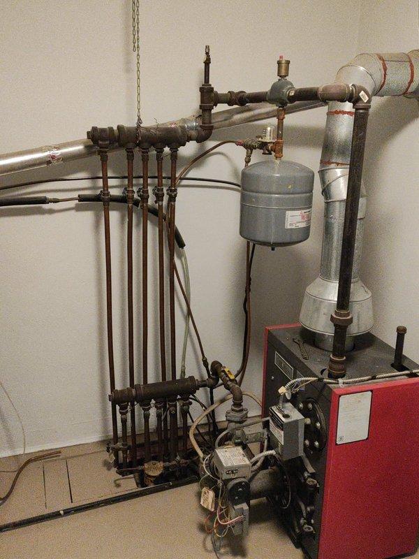 Performed a tune-up inspection on a 20-year-old Crown boiler system with underfloor heating. Identified one water circuit with a removed valve knob that was turned off, possibly due to prior leaking issues. Due to unfamiliarity with this specific older unit, recommended a follow-up visit from a specialized boiler technician for further evaluation.