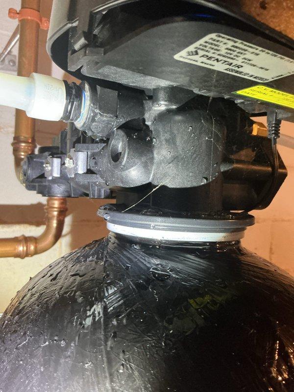 Responded to warranty service call for leaking water treatment system. Inspection of the Pentair equipment revealed broken components on the control valve assembly. Documented issue with photos, ordered replacement parts to resolve the leak.