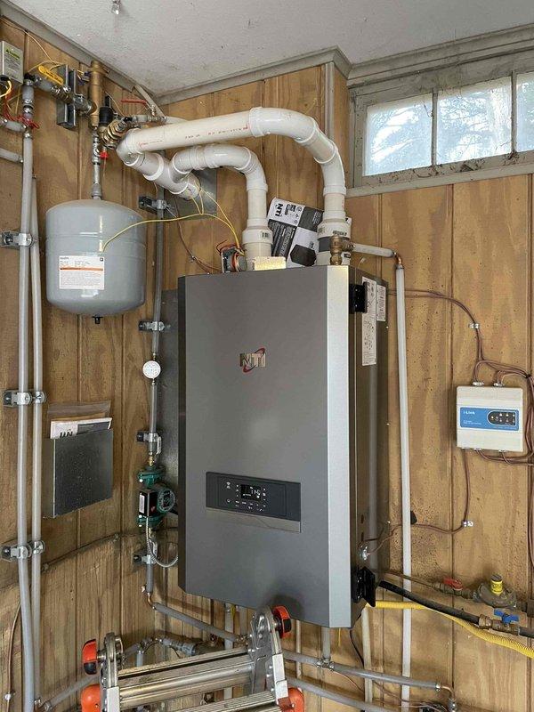 Responded to no-heat call for a 5-year-old NTI boiler system making abnormal noises. Diagnostic testing identified a malfunctioning zone valve for the upper level with stripped gears, preventing proper opening and hot water circulation. Successfully replaced the defective zone valve, restoring proper operation with verified hot water return and normal system function.