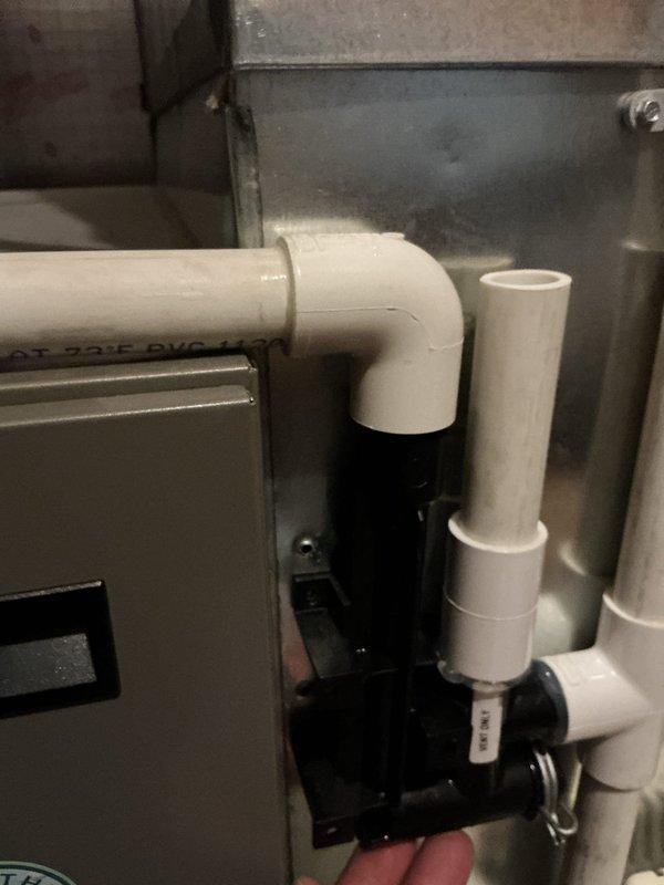 Responded to warranty callback for furnace installation from previous year experiencing condensation issues. Upon inspection, identified that condensation trap was leaking due to a fitting incorrectly attached to the wrong port without proper glue or silicone. Remedied issue by connecting PVC to the correct port location and properly sealing all fittings with appropriate adhesive.