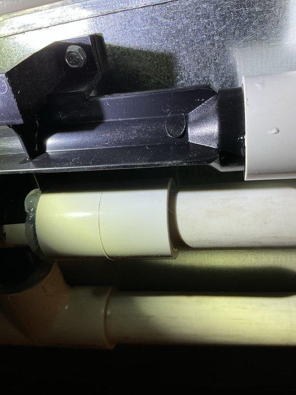Responded to warranty callback for furnace installation from previous year experiencing condensation issues. Upon inspection, identified that condensation trap was leaking due to a fitting incorrectly attached to the wrong port without proper glue or silicone. Remedied issue by connecting PVC to the correct port location and properly sealing all fittings with appropriate adhesive.
