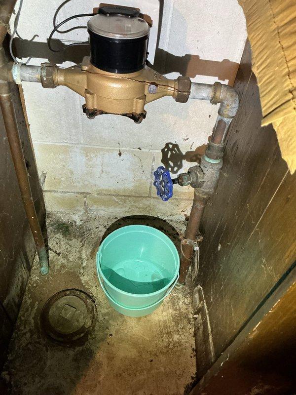 Responded to service call for water leak at main shut-off valve. Inspection revealed an active leak from the gate valve with visible corrosion, which continued regardless of valve position. After determining repair was not feasible, installed new ball valve for reliable water control. Coordinated with city water department to temporarily shut off water supply while completing installation.