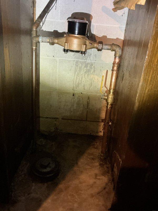 Responded to service call for water leak at main shut-off valve. Inspection revealed an active leak from the gate valve with visible corrosion, which continued regardless of valve position. After determining repair was not feasible, installed new ball valve for reliable water control. Coordinated with city water department to temporarily shut off water supply while completing installation.