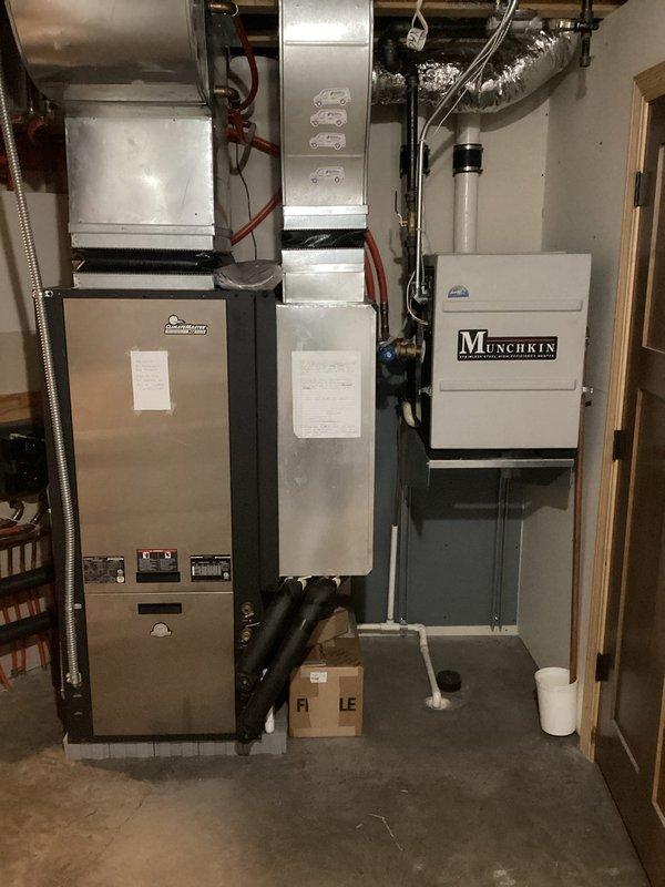 Diagnosed and resolved improper zone priority settings affecting in-floor heating system. Identified that upstairs in-floor heating had insufficient priority compared to other zones. Temporarily adjusted temperatures on competing zones to restore proper operation. Further tune-ups required for geothermal unit and boiler system.