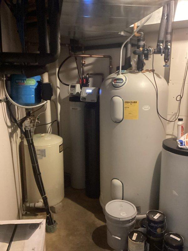 Diagnosed and resolved improper zone priority settings affecting in-floor heating system. Identified that upstairs in-floor heating had insufficient priority compared to other zones. Temporarily adjusted temperatures on competing zones to restore proper operation. Further tune-ups required for geothermal unit and boiler system.