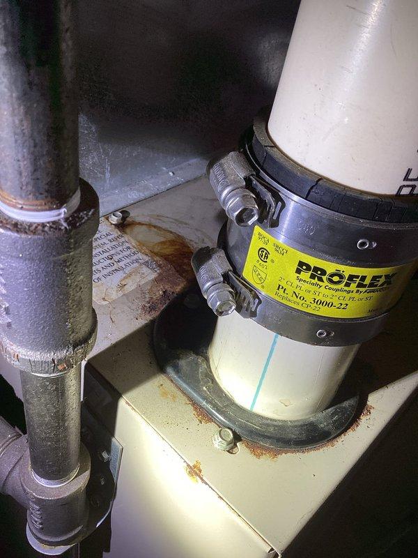 Performed comprehensive furnace inspection for home sale, examining heat exchanger with camera and confirming no cracks or holes present. Located and tightened loose Fernco coupler on exhaust pipe that was dripping water above furnace. All tests completed successfully with CO readings at 0.0 ppm in air stream; furnace deemed in good operational condition for its age.