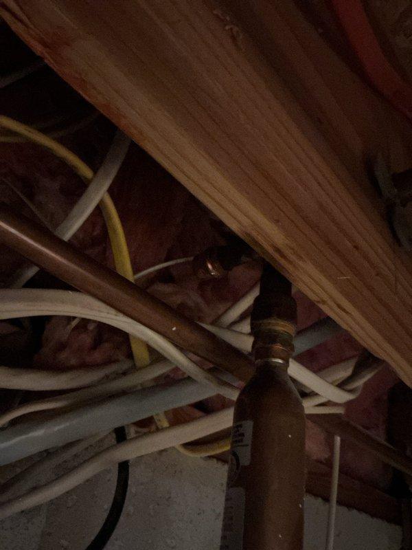 Replaced leaking outdoor sillcock and capped off old copper line for dishwasher. Installed new dishwasher stop valve with hammer arrestor under kitchen cabinets, requiring drilling access holes in cabinetry to complete the installation.