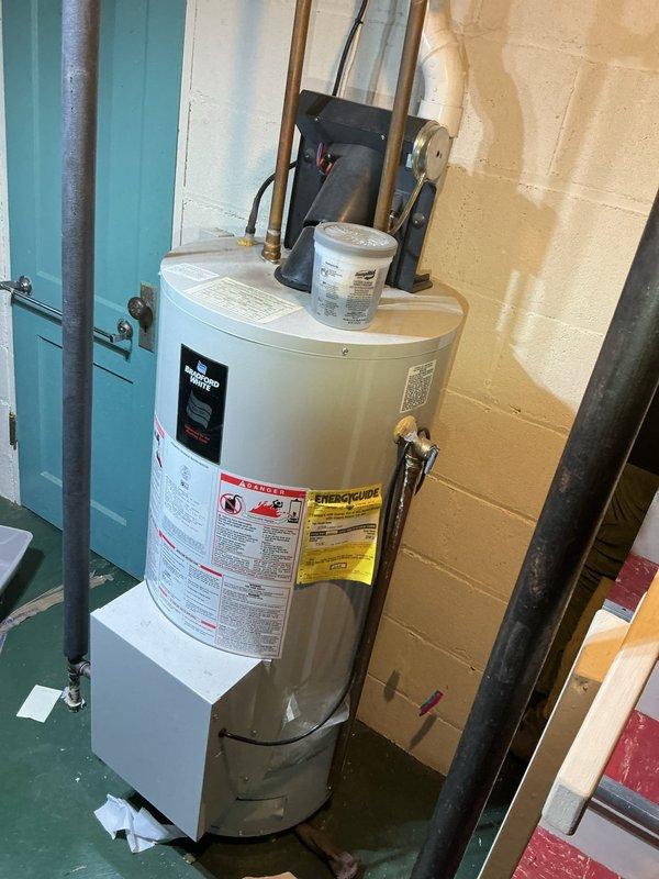 Responded to service call for clogged utility sink in basement. Diagnosed double concrete sink with drum trap preventing proper drainage. Removed existing drum trap assembly and installed new P-trap to restore proper drainage function.