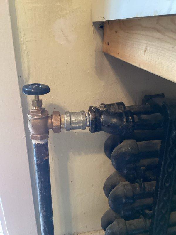 Installed new towel warmer radiator in the second floor bathroom, including mounting, connection to existing hydronic piping system, and installation of thermostatic valve. Completed first phase of boiler project, which included removing old radiator, capping bathroom lines, replacing radiator valve on upstairs unit, bleeding radiators, and removing gas line from upper level to kitchen.