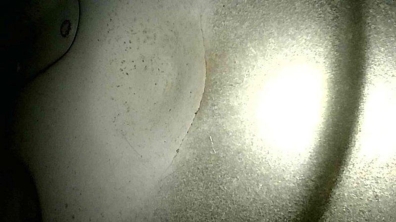 Performed diagnostic inspection on a 28-year-old natural gas furnace after customer reported popping noises and gas odor. Visual inspection revealed a compromised heat exchanger, which poses a safety hazard. Discussed replacement options with homeowner and scheduled follow-up for equipment quote.