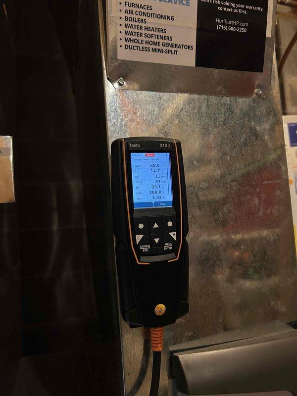 Performed comprehensive furnace tune-up on 12-year-old gas unit. Removed rust and debris from inducer motor housing, verified proper gas manifold pressures on both stages, confirmed safe CO readings, and validated normal thermostat/blower operation. Cleaned condensate trap and drain line, inspected heat exchanger surfaces, and confirmed all components functioning properly. System operating normally with no issues detected. Provided information on rewards program and recommended stocking additional filters.