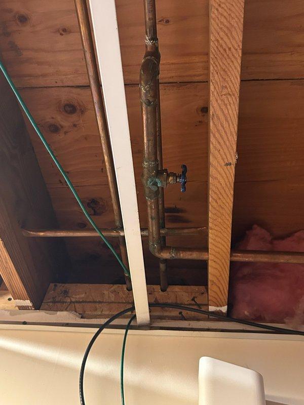 Inspected outdoor spigot system and identified non-frost free fixture with a corroded copper supply line and leaking gate valve. Shut off water supply to the spigot and performed diagnostic assessment of the installation. Provided customer with recommendations for replacement of outdated gate valve and installation of frost-free spigot to prevent future freeze damage.