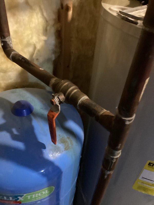 Replaced leaking irrigation valve connected to Well-Xtrol expansion tank system. Inspected copper piping configuration and verified proper function after installation of new valve assembly.