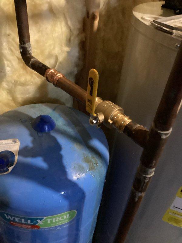 Replaced leaking irrigation valve connected to Well-Xtrol expansion tank system. Inspected copper piping configuration and verified proper function after installation of new valve assembly.