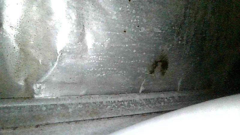 Performed furnace tune-up on natural gas system. Identified humming inducer motor and aging hot surface ignitor with low output. Replaced ignitor due to age. Conducted pressure testing with dual-port manometer, readings at 378/375. Noted moisture/water damage on adjacent wall structure requiring attention.