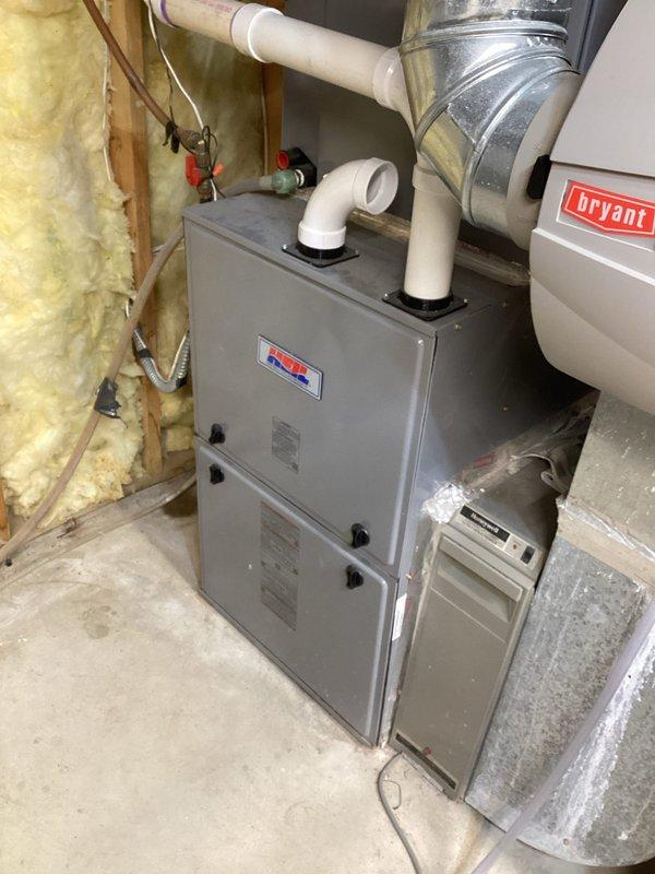 Performed furnace tune-up including inspection of heat exchanger, burners, blower, safety switches, gas pressures, and ventilation system. Diagnosed noise issue with ECM blower motor requiring replacement. Identified seized HRV fan motor showing excessive heat, posing potential fire hazard - shut down HRV and recommended equipment replacement. System otherwise functioning properly.