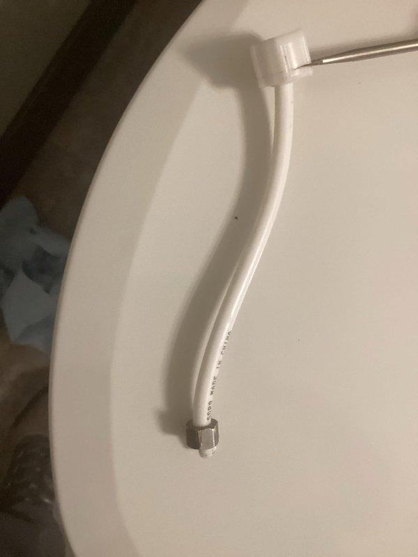 Responded to emergency call for toilet valve malfunction that caused significant water leakage. Identified broken nut at bottom of toilet tank as the source of the leak. Replaced water supply line in main bathroom and installed a second preventative water line replacement on adjacent toilet at customer request to prevent future incidents.
