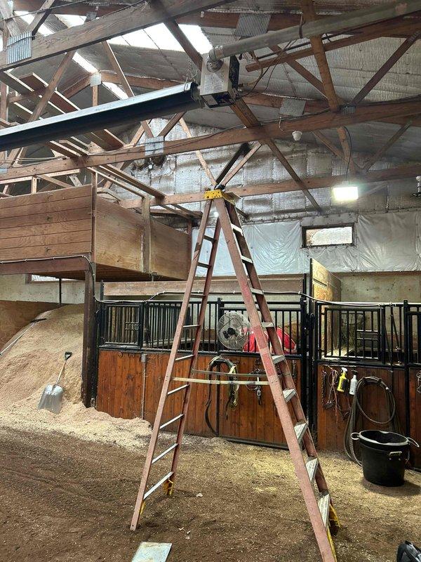 Performed diagnostic service on tubular heater in customer's barn that was non-operational. Inspection revealed pressure switch was stuck, preventing proper ignition. System is difficult to access, requiring ladder to reach overhead unit mounted in stable/equine facility. Discussed replacement options for barn heating units with customer. Also noted gas fireplace in house requires service, but was not addressed during this visit.