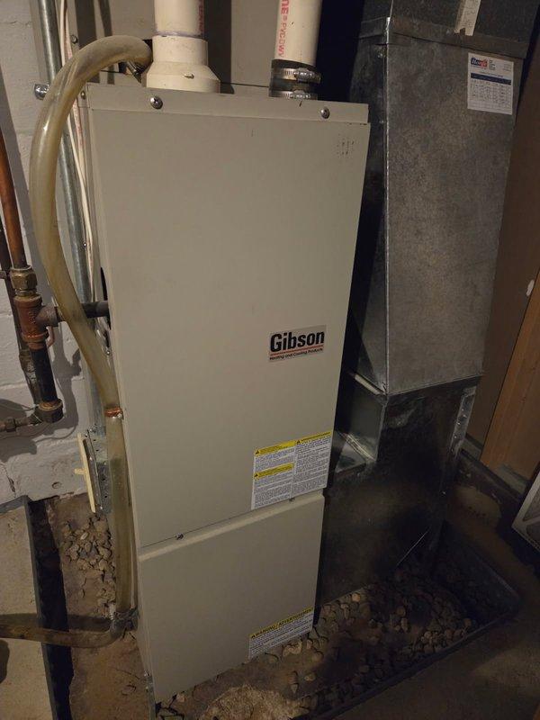 Diagnosed cycling heat issue in Gibson furnace where unit was running briefly then shutting down. Determined inducer motor had failed and was filled with water. Due to age of system (10+ years) and extent of damage, recommended and performed complete unit replacement with new Gibson heating system, properly installed with all connections secured.