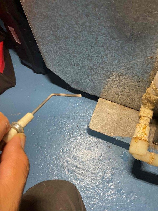 Performed scheduled furnace tune-up on 10-year-old natural gas unit. Inspection revealed rusted heat exchanger as documented in photographs. System currently operational but customer advised to monitor closely and prepare for replacement in near future.