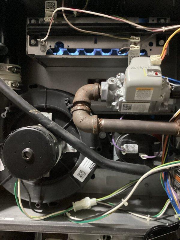 Performed scheduled furnace tune-up on 8-year-old system. Inspected burner assembly with visible blue flame pattern confirming proper combustion. Checked all electrical connections, blower motor operation, and gas valve functionality. System is operating correctly with no issues identified. Recommended continuing regular maintenance schedule.