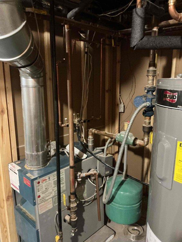 Responded to no-heat complaint for 23-year-old Utica boiler system. Discovered gas valve was left in pilot position rather than "on" position and corrected the setting. After adjustment, boiler fired properly and all radiators began producing heat. Performed comprehensive safety check and combustion analysis, confirming proper burning with no CO leakage around jacket.