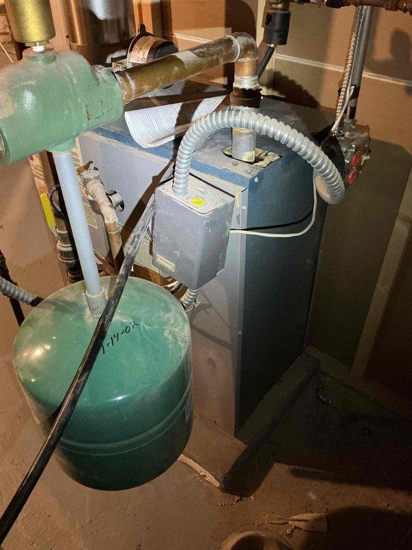 Responded to no-heat complaint for 23-year-old Utica boiler system. Discovered gas valve was left in pilot position rather than "on" position and corrected the setting. After adjustment, boiler fired properly and all radiators began producing heat. Performed comprehensive safety check and combustion analysis, confirming proper burning with no CO leakage around jacket.