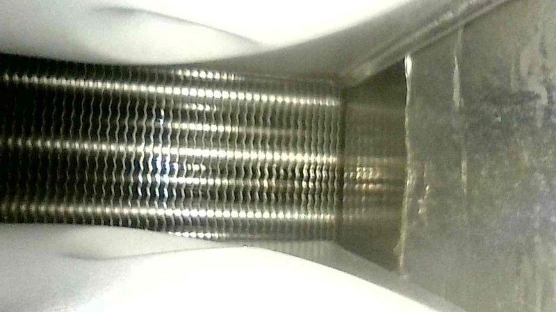 Performed scheduled tune-up on 15-year-old furnace to ensure proper operation and efficiency. Visual inspection revealed rust developing on heat exchanger, with photos documenting the condition of burner assembly and evaporator coil. Customer reported slight squeaking noise from fan which was noted for monitoring. Advised customer to keep watch on heat exchanger condition due to visible corrosion.