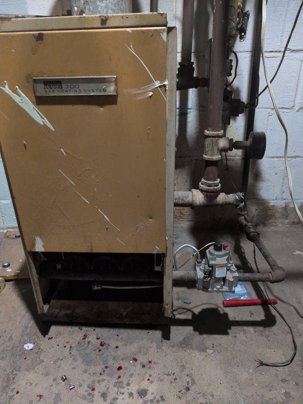 Diagnosed no heat issue on 60-year-old Ward 700 gas boiler system. Found failed aquastat relay with chattering contactor preventing proper operation. Verified control transformer power supply was functional. Prepared recommendation for comprehensive system upgrade including aquastat replacement, thermostat installation, and complete rewiring to restore safe operation.