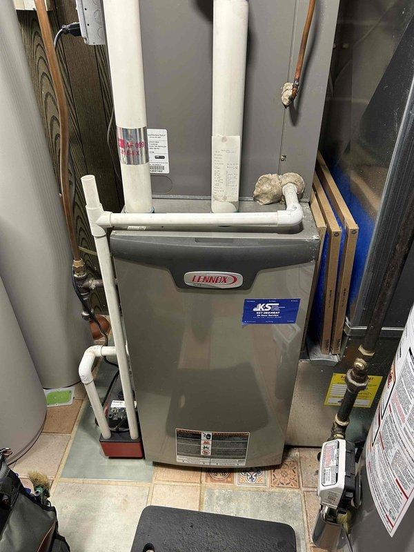 Performed complete furnace tune-up and safety check on 12-year-old Lennox unit. Conducted comprehensive inspection including gas leak detection, pressure switch verification, carbon monoxide testing, flame igniter testing, and gas pressure adjustments for both heating stages. All systems verified operating correctly with no issues found.