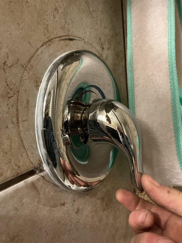 Returned to resolve an issue with previously installed tub spout that failed to adhere properly to wall. Found spout approximately 2.5 inches from wall with significant leakage due to failed caulking and an improperly pressed coupling. Completely re-piped line from valve to spout, secured spout to wall with proper sealing, and tightened handle assembly to ensure proper function.