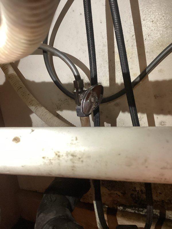 Responded to service call for kitchen sink leak. Identified spraying water from hot side angle valve. Replaced both hot and cold angle valves to resolve the issue and prevent future leakage.