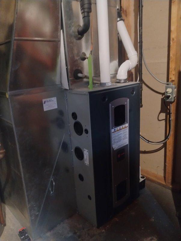 Diagnosed 5-year-old natural gas furnace (Goodman model V-B060U_V) displaying error code for inducer pressure switch/condensate switch and blowing cold air. Upon inspection, confirmed control board failure to supply power to inducer motor despite proper triggering sequence. Provided temporary space heater while ordering replacement control board to restore heating function.