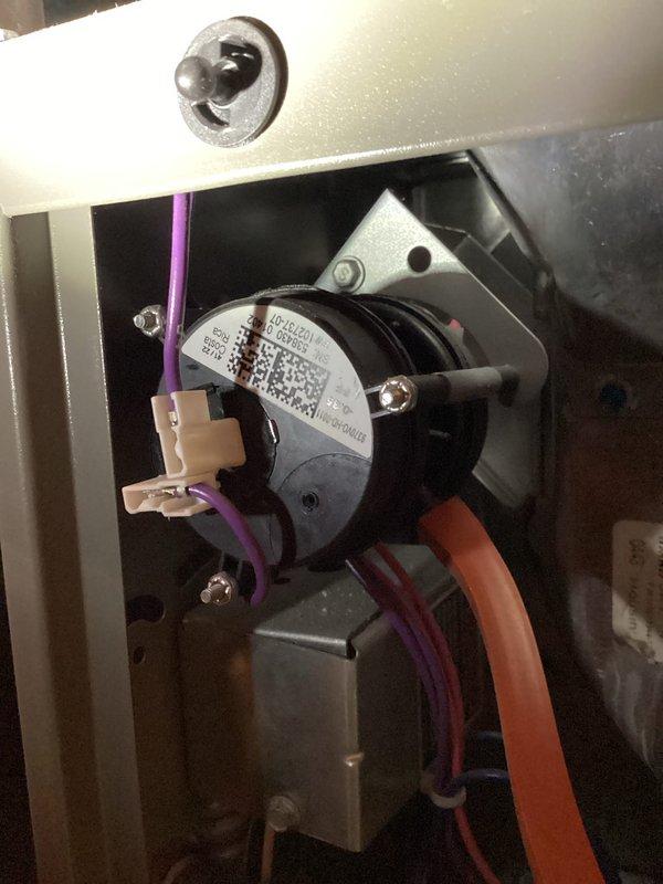 Responded to no-heat call for 1.5 year old natural gas furnace. Diagnostic testing revealed obstructed pressure switch hose preventing proper operation. Cleared blockage, verified proper system function, and restored heat.