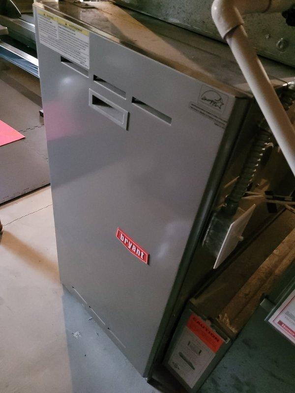 Responded to no heat call for 20-year-old Bryant natural gas furnace exhibiting short cycling and error code 13. Inspection revealed a suspected cracked heat exchanger, confirmed through visual assessment of the interior components. Reset system temporarily restored operation, but recommended replacement due to age and safety concerns.