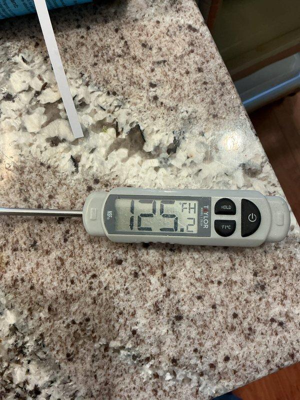 Diagnosed hot water system issue which was incorrectly attributed to faulty cartridges. Identified and confirmed a defective 1-inch check valve allowing hot water to bleed into the domestic cold water line, resulting in 107°F water entering the water softener. Measurements showed system temperatures between 125-126°F. Follow-up includes ordering replacement check valve.