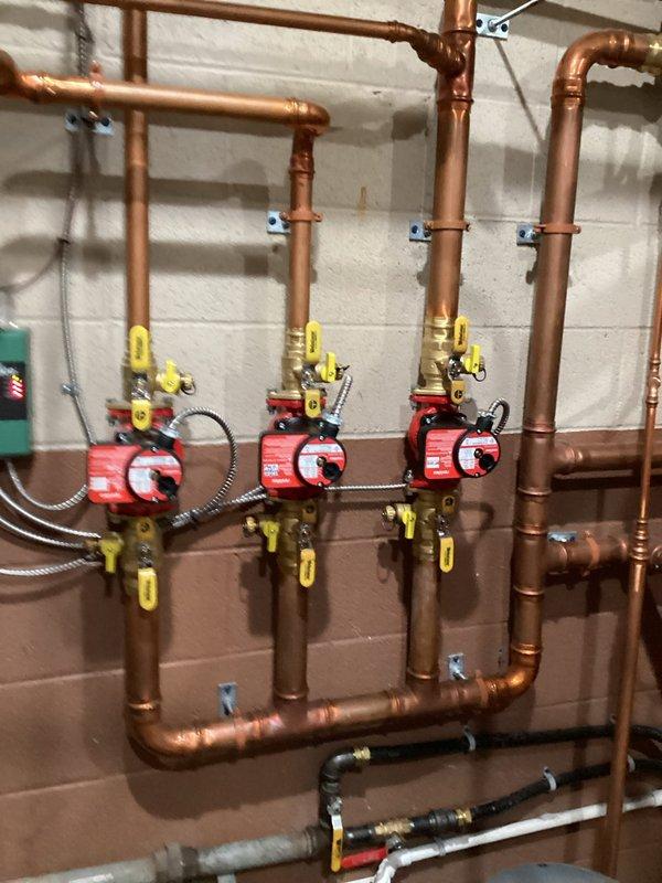 Successfully installed two new red circulator pumps with brass shut-off valves on copper pipes for the boiler system and main maintenance area as per estimate. Reprogrammed thermostat in back office, restoring functionality to the second non-working furnace.