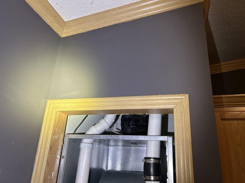 Diagnosed furnace failure caused by broken intake elbows in the attic that allowed insulation to be drawn into the burner box, preventing ignition. Cleaned all plugged burner components and orifices, temporarily disconnected the intake to allow room air usage, and taped off the intake end to prevent further insulation ingestion. Requested installation crew return to properly re-vent the system.