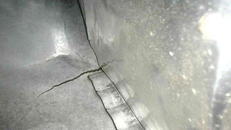 Responded to no heat service call for 10+ year old natural gas furnace. Diagnostic inspection revealed a cracked heat exchanger, presenting a significant safety hazard. Complete furnace replacement was performed to restore proper heating function and ensure safe operation.