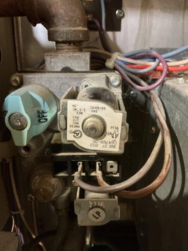 Responded to no heat call on 30-year-old Amana furnace. Diagnostic testing confirmed heat exchanger was intact but gas valve had failed despite receiving proper 24V signal. After discussing equipment age with customer, replaced defective gas valve to restore heating function.