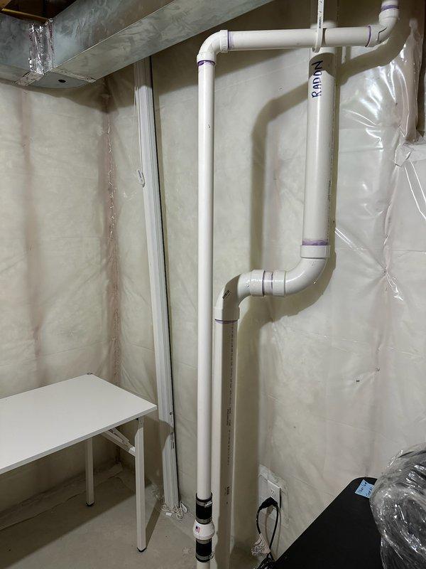 Responded to service call regarding a continuously running sump pump with suspected condensation or leakage on the discharge pipe. Upon inspection, determined the issue was caused by either an air lock in the system or a malfunctioning check valve. Verified the sump pump installation including PVC piping configuration and proper electrical connections to restore normal operation.